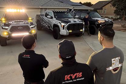 KYB-team-standing-in-front-of-test-rigs