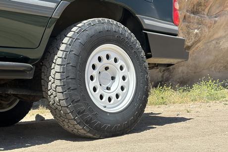 OVR LC100's Nomad Convoy wheels are fitted with Toyo Open Country A/T III tires.