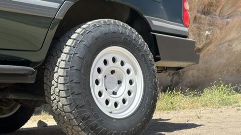 OVR LC100's Nomad Convoy wheels are fitted with Toyo Open Country A/T III tires.