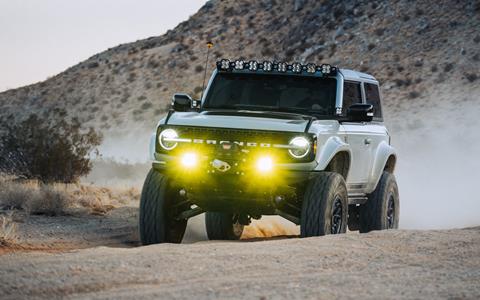 Peak Suspension 2-door Ford Bronco speeding in desert