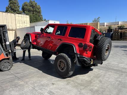 25. Before heading out on our first test drive, the Rock Jock crew grabbed the company forklift, allowing us to fully articulate the Jeep and check for any clearance issues, of which we found none