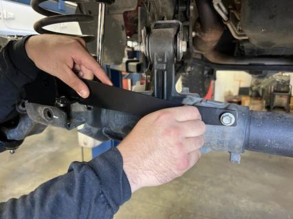 15. Rock Jock provides this trac bar relocation bracket that also doubles as a new steering stabilizer mount