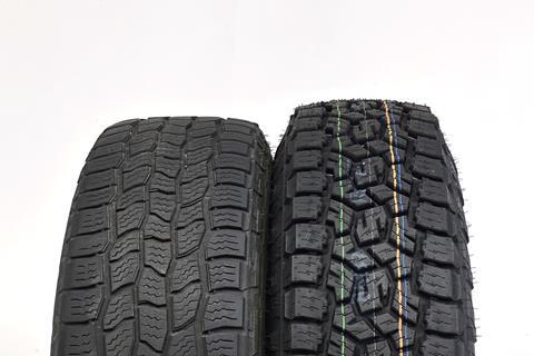 The size difference between the Land Cruiser's old tires (left) and new (right).