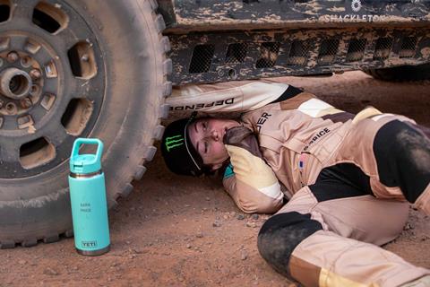 Sara-Price-504-driver-under-rally-rig_credit-Mercedes-Lilienthal