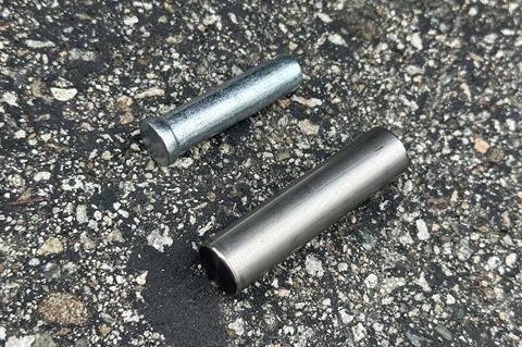 The standard clevis pin versus Factor 55’s titanium double sheer pin.