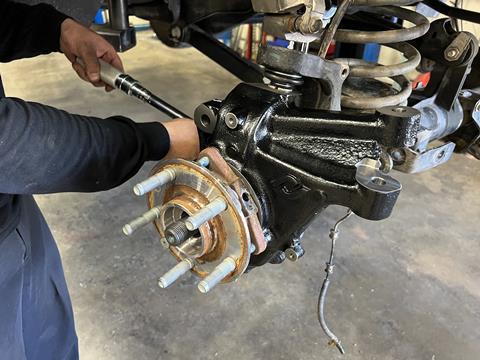 13. With the axle shaft in place, we reinstalled the factory unit bearing