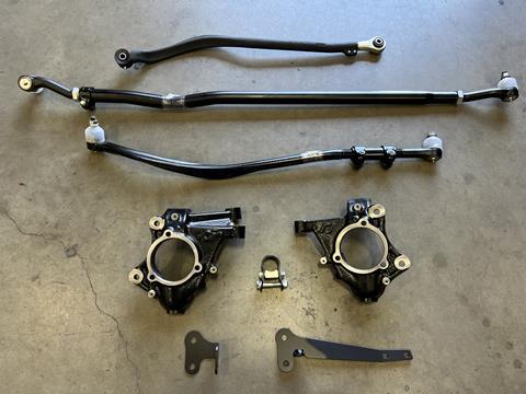 5. Here are the main parts included with our Rock Jock upgrade. From top to bottom is the trac bar, tie rod, drag link, knuckles, and steering brackets