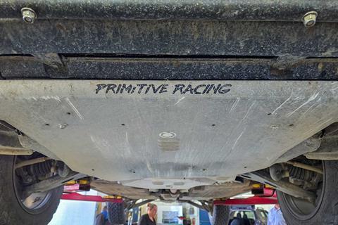 Flower-Subaru,-Montrose,-CO,-inspecting-Primitive-Racing-skids-post-CO-trails_credit-Mercedes-Lilienthal