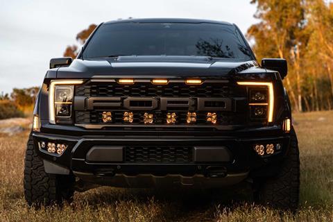 3rd Gen Ford Raptor equipped with Baja Designs Squadron 2.0 LED light pods installed using vehicle-specific mounting kit