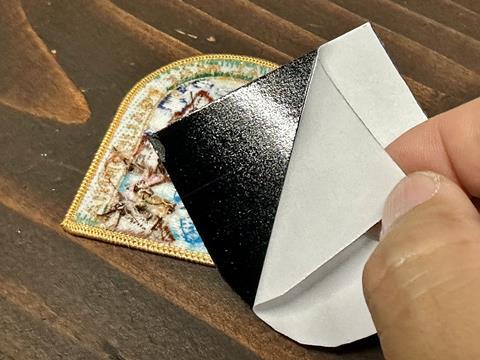 4 -Once the hook is sized correctly, peel the paper backing off